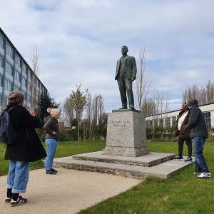 People view statue of Bata factory founder