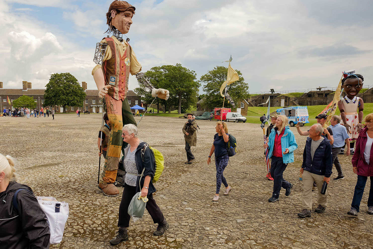 A large puppet representing a Tilbury dock worker greets walkers arriving at Tilbury Fort