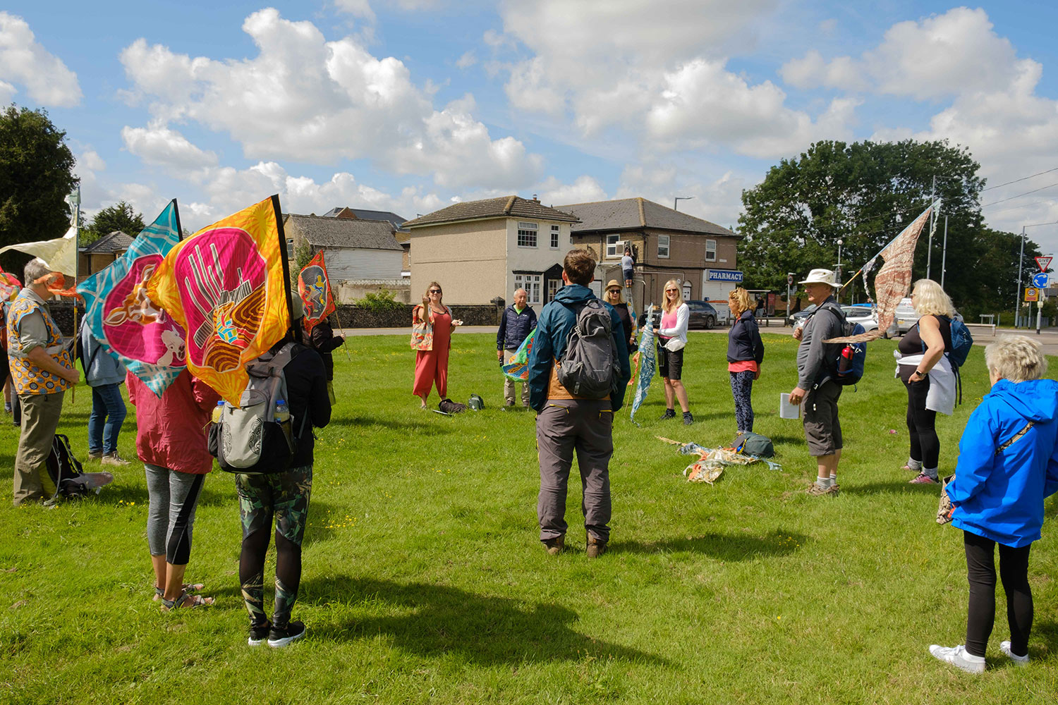Katie Beadle talks to a circle of walkers stood on Ockendon village green