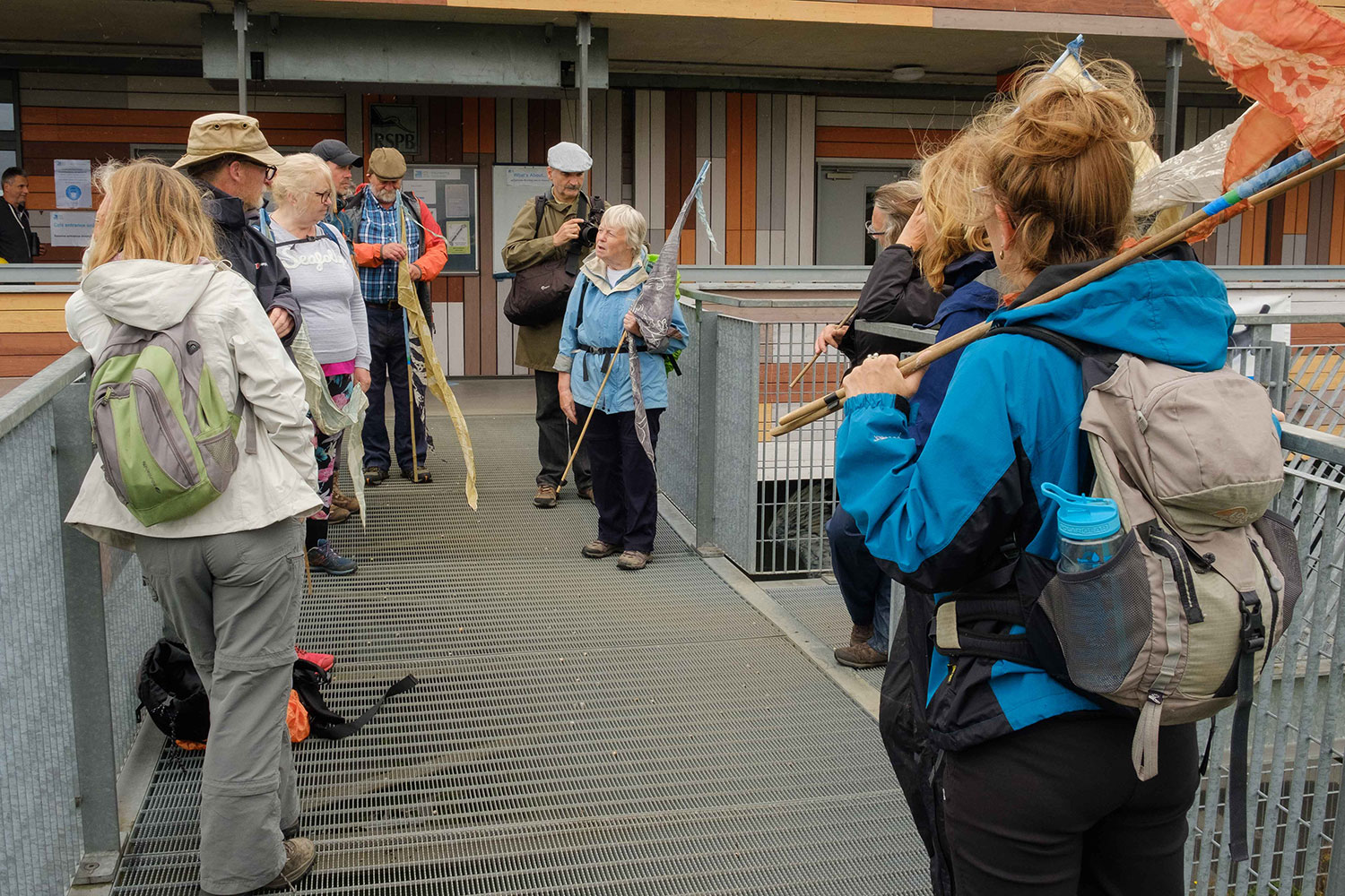 Lesley Robinson speaks to a group of walkers outside the RSPB Rainham Marshes visitor centre