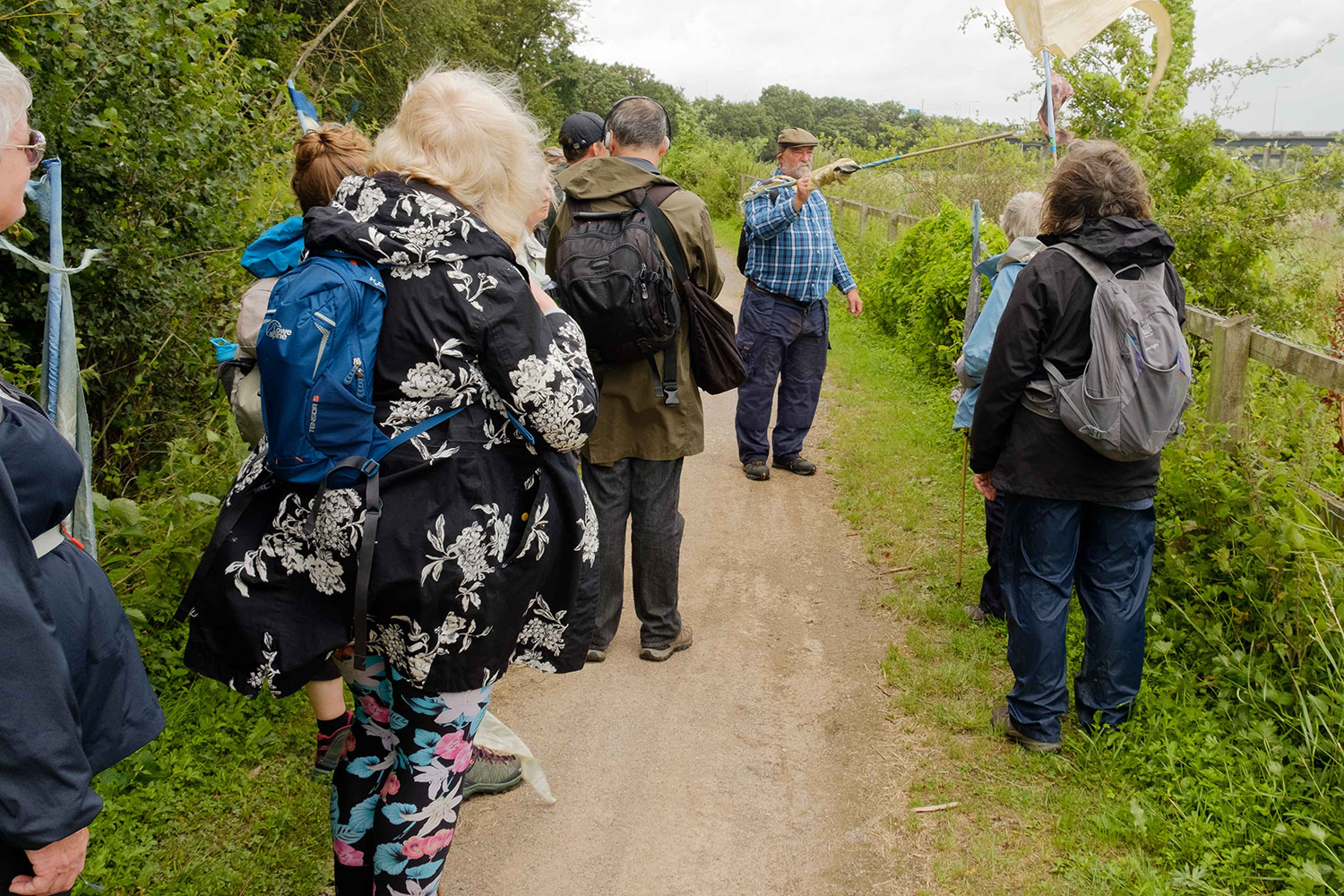 Stephen Green talks about the area to a group of walkers stopped on a green lane